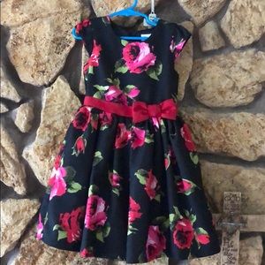 Black dress with red and green flowers